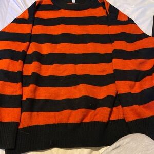 orange and black striped sweater
